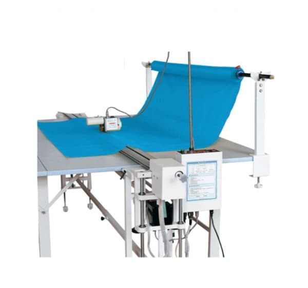 Automated fabric cutting table built by HCW USA for curtain and drapery production lines